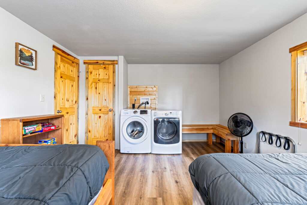 Ponderosa Pine Cabin bedroom area with washer and dryer.
