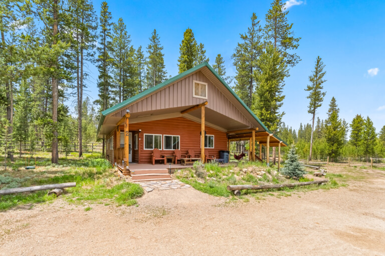 Bonanza Cabin surrounded by pine trees in Stanley, Idaho.