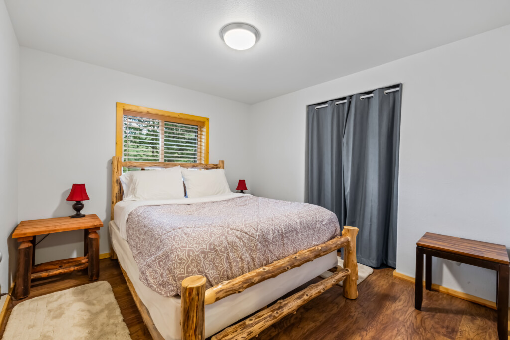 Primary Bedroom Primary Bedroom at Valley Creek Cabin with comfortable bed and natural light.