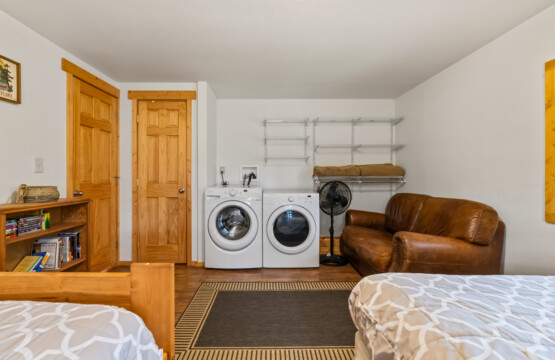 Valley Creek Cabin bedroom area with washer and dryer.