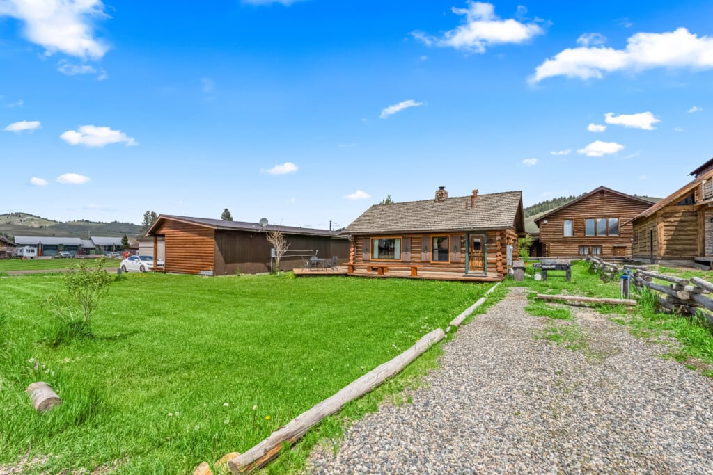 Wall Street Cabin exterior with grassy yard in summer