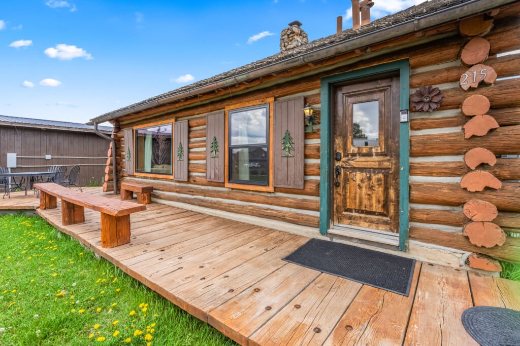 Summer exterior of Wall Street Cabin with wood deck