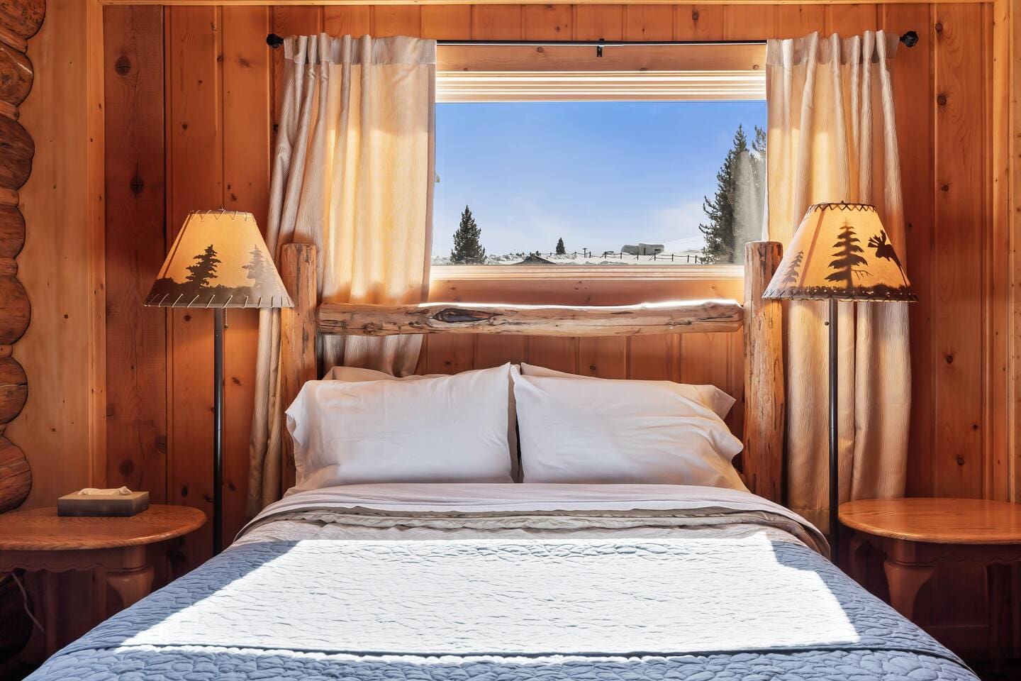 Primary Bedroom queen-size bed with window view